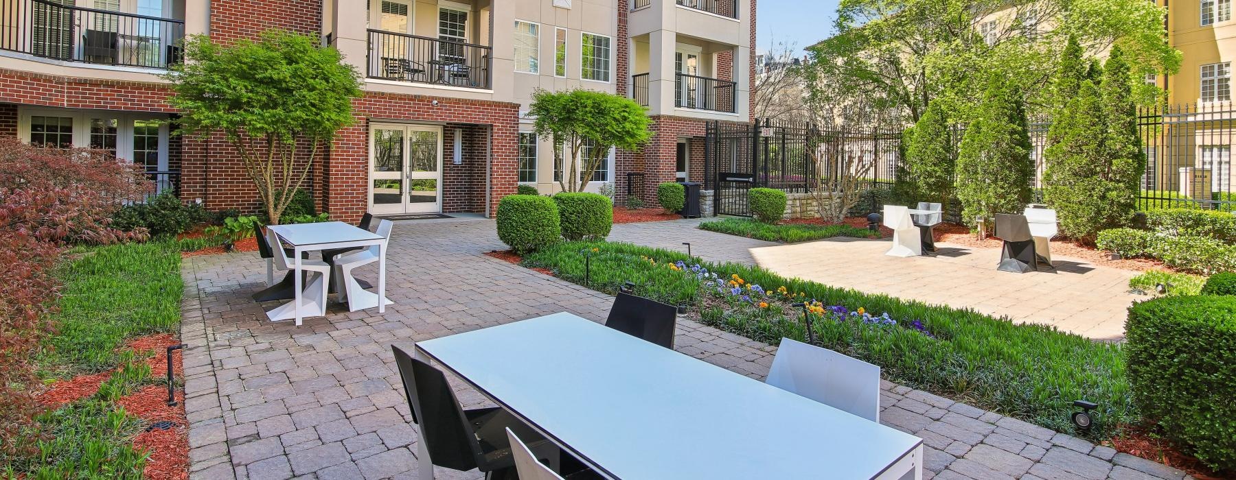 tables with chairs in a courtyard